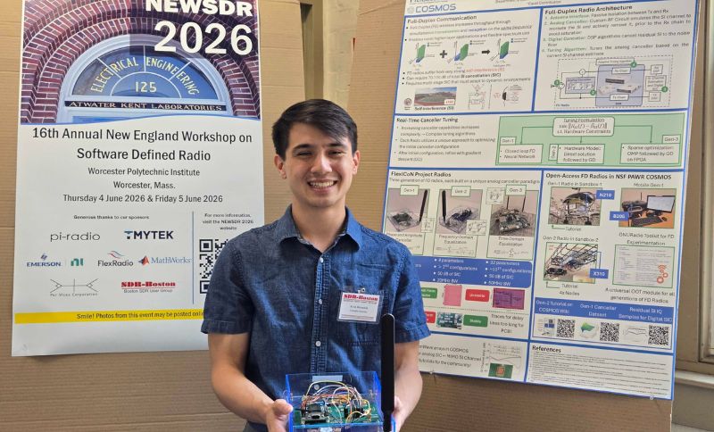 PhD Student Kevin Hermstein holding a FD radio alongside the poster.